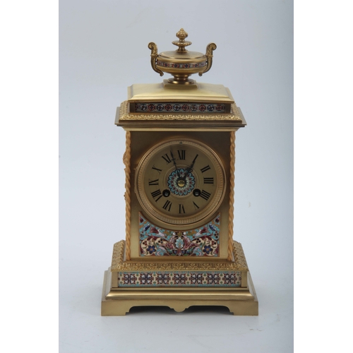 1010 - A LATE 19TH CENTURY FRENCH LACQUERED BRASS AND CHAMPLEVE ENAMEL MANTEL CLOCK with stepped leaf edged... 