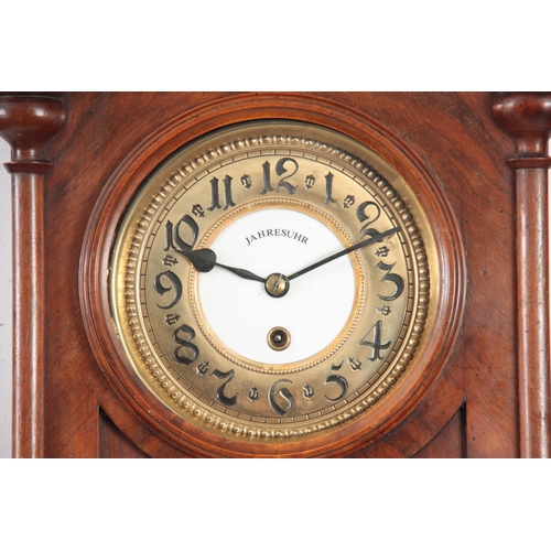 1019 - AN EARLY 20th CENTURY WALNUT CASED 400 DAY WALL CLOCK SIGNED JAHRESUHR the Vienna style case with de... 