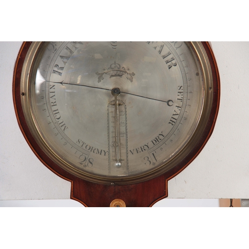 1027 - FRANCIS WEST. LONDON. A GEORGE III FIGURED MAHOGANY WHEEL BAROMETER WITH CLOCK the round top case wi... 