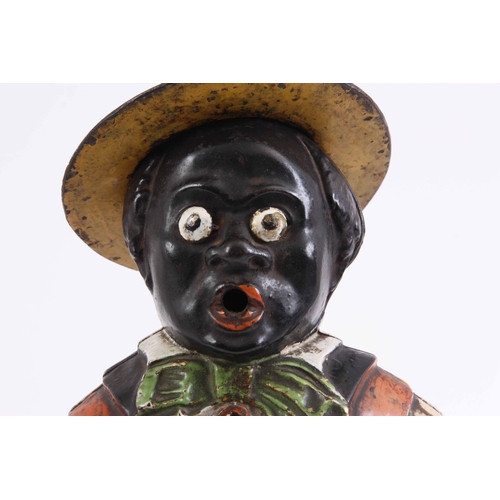 1042 - A LATE 19TH CENTURY AMERICAN PAINTED CAST IRON MANTLE CLOCK formed as a black banjo player with remo... 