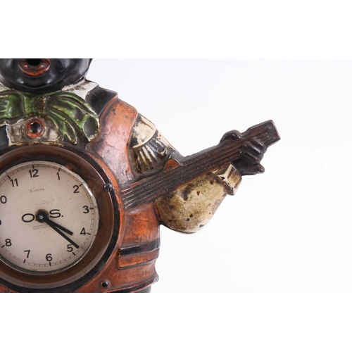 1042 - A LATE 19TH CENTURY AMERICAN PAINTED CAST IRON MANTLE CLOCK formed as a black banjo player with remo... 