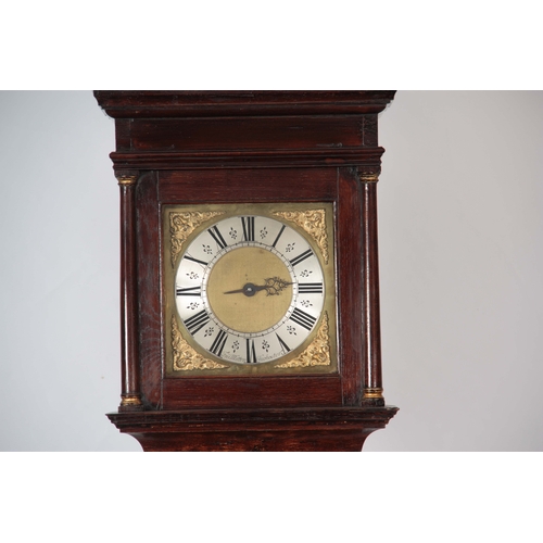 1043 - FRANCIS MITTEN, CHICHESTER. AN EARLY 18th CENTURY OAK LONGCASE CLOCK  the hood having a moulded pedi... 