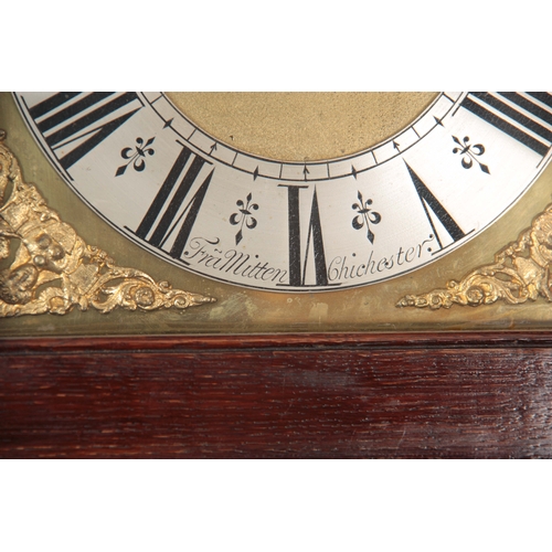 1043 - FRANCIS MITTEN, CHICHESTER. AN EARLY 18th CENTURY OAK LONGCASE CLOCK  the hood having a moulded pedi... 