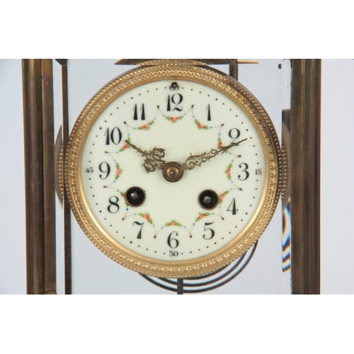 1072 - AN EARLY 20th CENTURY FRENCH MARBLE AND ORMOLU FOUR-GLASS MANTEL CLOCK the case surmounted by a gilt... 