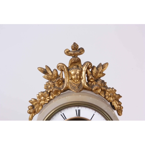 1081 - A FRENCH LATE 19th CENTURY SWINGING CHERUB MANTLE CLOCK the ormolu mounted onyx case enclosing a ske... 