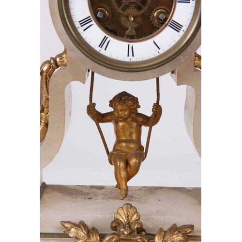 1081 - A FRENCH LATE 19th CENTURY SWINGING CHERUB MANTLE CLOCK the ormolu mounted onyx case enclosing a ske... 