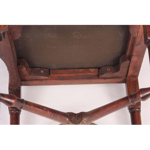 1334 - A MID 18TH CENTURY WALNUT CORNER CHAIR with vase shaped back splats, scrolled arms and turned suppor... 