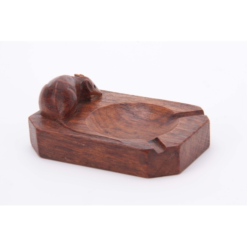 879 - A ROBERT MOUSEMAN THOMPSON OAK ASHTRAY of clipped and rounded rectangular form with carved mouse tra... 