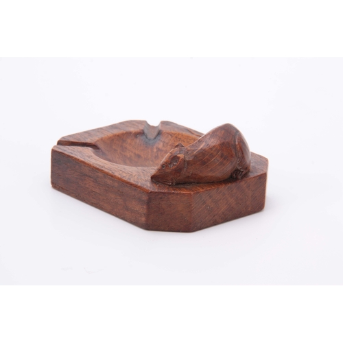 879 - A ROBERT MOUSEMAN THOMPSON OAK ASHTRAY of clipped and rounded rectangular form with carved mouse tra... 