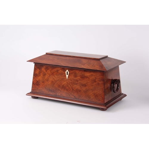 895 - A MID 19th CENTURY FIGURED MAHOGANY SARCOPHAGUS SHAPED TEA CADDY with hoop side handles and hinged l... 