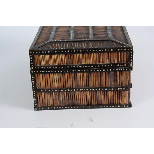 906 - A 19TH CENTURY ANGLO-INDIAN PORCUPINE QUILS BOX with panelled chamfered top having ebony and bone in... 