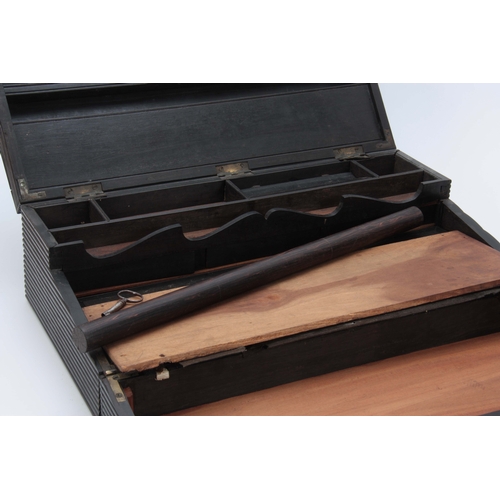 908 - A MID 19th CENTURY ANGLO-INDIAN EBONY WRITING SLOPE of ribbed design opening to reveal a fitted inte... 