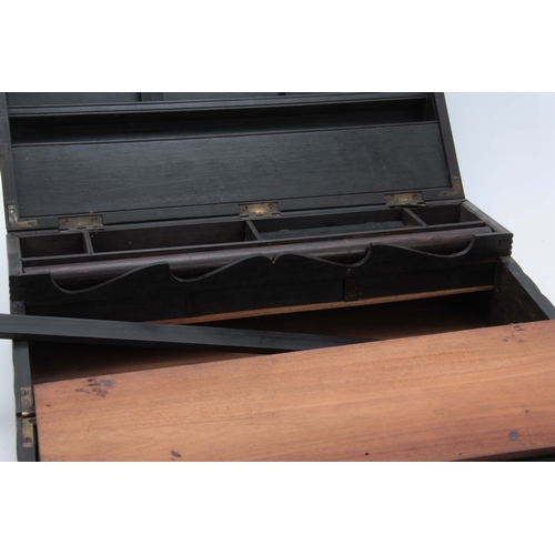 908 - A MID 19th CENTURY ANGLO-INDIAN EBONY WRITING SLOPE of ribbed design opening to reveal a fitted inte... 