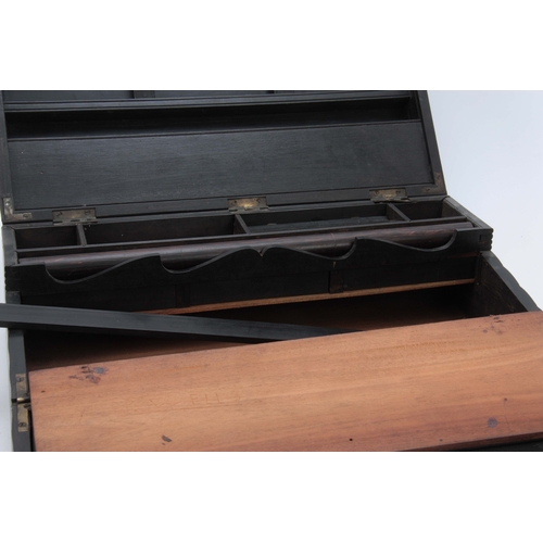 908 - A MID 19th CENTURY ANGLO-INDIAN EBONY WRITING SLOPE of ribbed design opening to reveal a fitted inte... 