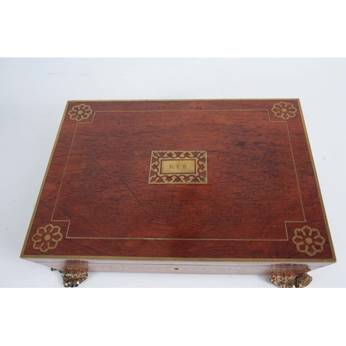 915 - A REGENCY BRASS INLAID ROSEWOOD GLOVE BOX having angled sides and leaf cast brass side handles and f... 