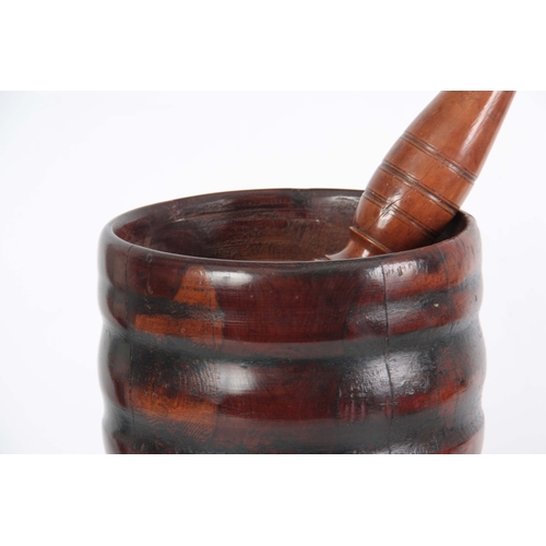 936 - AN 18TH CENTURY YEW-WOOD PESTLE AND MORTAR of ribbed bulbous form with later Pestle 23cm high 20cm d... 