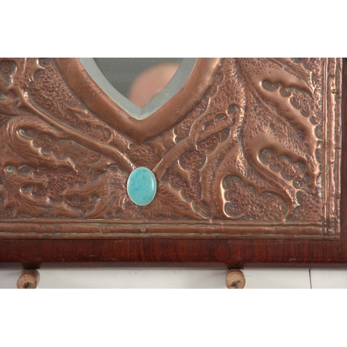 947 - AN EARLY 20th CENTURY ARTS & CRAFTS GLASGOW SCHOOL COPPER MIRROR of hammered design with thistle... 