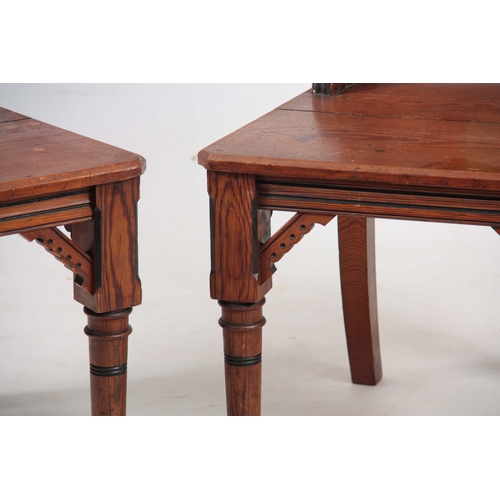 959 - A PAIR OF LATE 19TH CENTURY AESTHETIC PERIOD GOTHIC REVIVAL PITCH PINE HALL CHAIRS IN THE MANER OF A... 