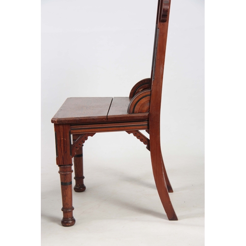 959 - A PAIR OF LATE 19TH CENTURY AESTHETIC PERIOD GOTHIC REVIVAL PITCH PINE HALL CHAIRS IN THE MANER OF A... 