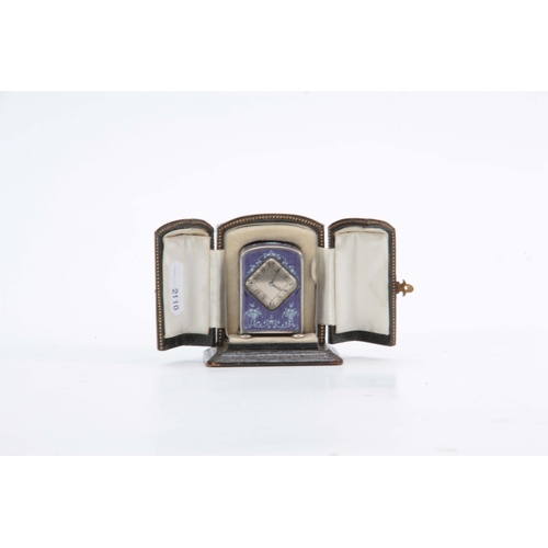 971 - AN EARLY 20th CENTURY MINIATURE SILVER ENAMEL BOUDOIR CLOCK having a purple enamel on engine-turned ... 