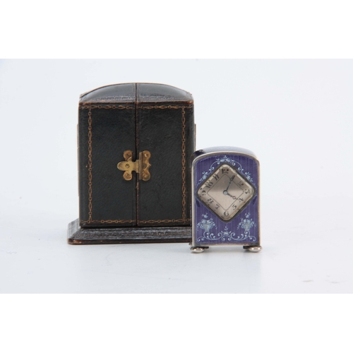 971 - AN EARLY 20th CENTURY MINIATURE SILVER ENAMEL BOUDOIR CLOCK having a purple enamel on engine-turned ... 