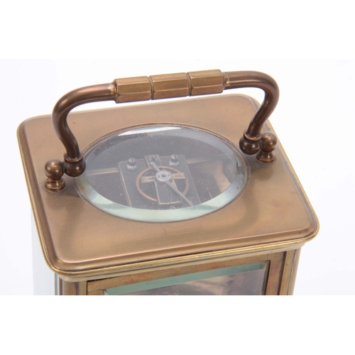 976 - A LATE 19TH CENTURY FRENCH BRASS STRIKING CARRIAGE CLOCK the corniche case with enamel dial and Roma... 