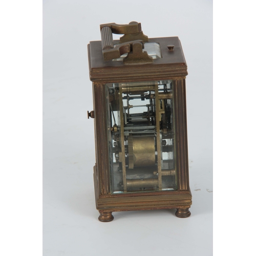 978 - A LATE 19th CENTURY FRENCH REPEATING CARRIAGE CLOCK the brass case with reeded corners enclosing a f... 