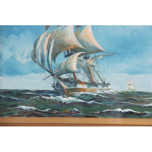 837 - H W MOORE OIL ON BOARD depicting two galleons in full sail - signed dated 1935, mounted in a glazed ... 