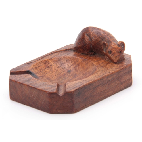 879 - A ROBERT MOUSEMAN THOMPSON OAK ASHTRAY of clipped and rounded rectangular form with carved mouse tra... 