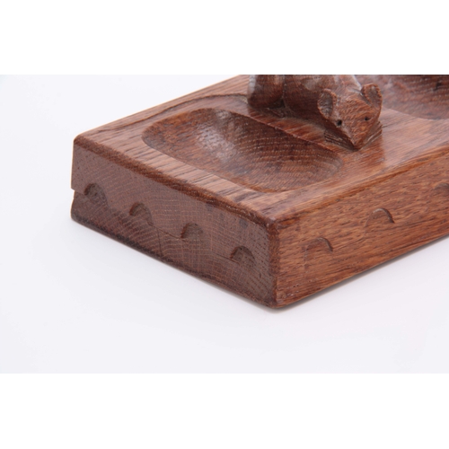 880 - AN EARLY ROBERT MOUSEMAN THOMPSON OAK PIN TRAY of rectangular form with arcaded moulded edge and car... 