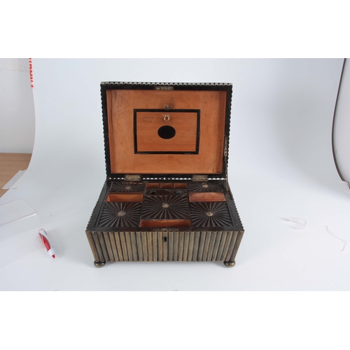 907 - A REGENCY ANGLO-INDIAN VIZAGAPATAN HORN WORKBOX having reeded veneer work, the hinged lid opening to... 