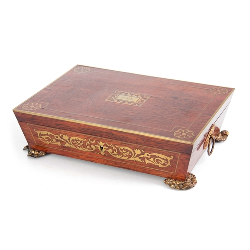 915 - A REGENCY BRASS INLAID ROSEWOOD GLOVE BOX having angled sides and leaf cast brass side handles and f... 