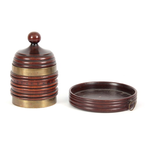 922 - A LATE GEORGIAN BRASS BOUND RIBBED MAHOGANY TOBACCO JAR of conical shape with ball finial to the lid... 