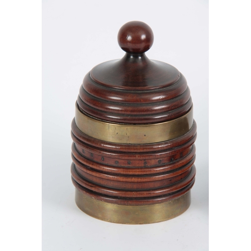 922 - A LATE GEORGIAN BRASS BOUND RIBBED MAHOGANY TOBACCO JAR of conical shape with ball finial to the lid... 