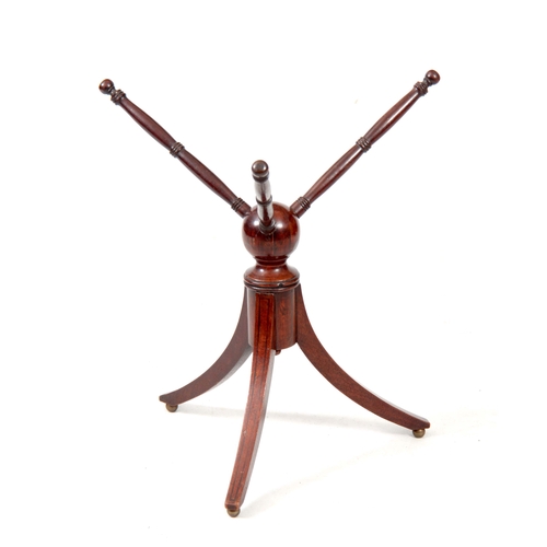 930 - A REGENCY EBONISED INLAID MAHOGANY CAT / BOWL STAND with ring turned revolving top above a tripod sp... 