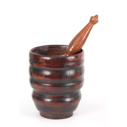 936 - AN 18TH CENTURY YEW-WOOD PESTLE AND MORTAR of ribbed bulbous form with later Pestle 23cm high 20cm d... 