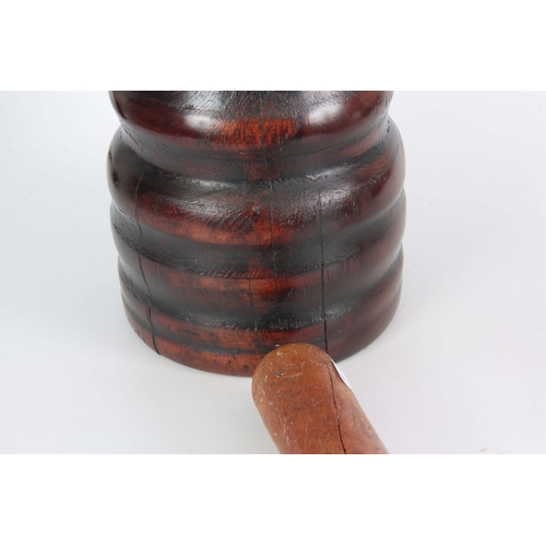 936 - AN 18TH CENTURY YEW-WOOD PESTLE AND MORTAR of ribbed bulbous form with later Pestle 23cm high 20cm d... 