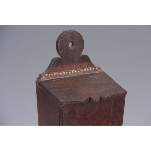 938 - A GEORGE III TAPERING OAK CANDLE BOX with ring-shaped back and hinged cover 42cm high 17.5cm wide