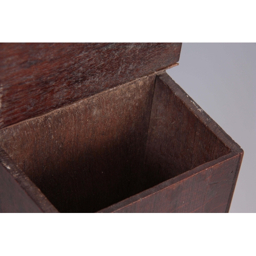 938 - A GEORGE III TAPERING OAK CANDLE BOX with ring-shaped back and hinged cover 42cm high 17.5cm wide