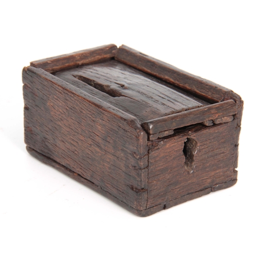 939 - A RARE 16TH CENTURY OAK MONEY BOX with a sliding top the lock missing 10cm wide 7cm wide  5cm high.