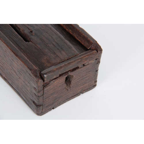 939 - A RARE 16TH CENTURY OAK MONEY BOX with a sliding top the lock missing 10cm wide 7cm wide  5cm high.