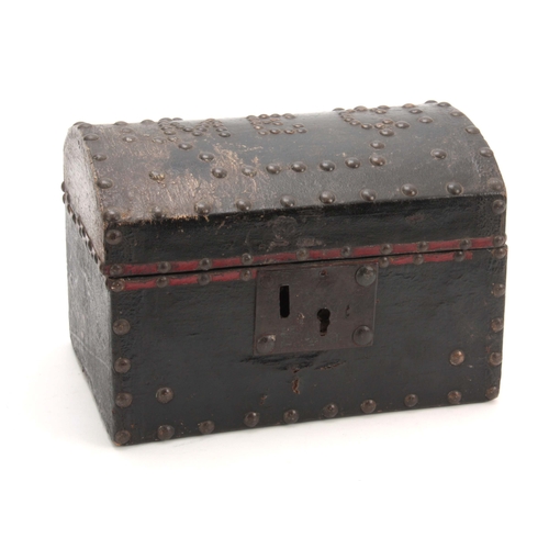 942 - AN EARLY 18TH CENTURY DOME TOPPED LEATHER BOUND AND BRASS STUDDED TRUNK of small proportions initial... 