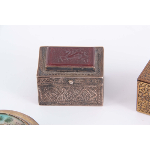 943 - A COLLECTION OF THREE SMALL PERSIAN BOXES, a White metal engraved with a geometric pattern having a ... 