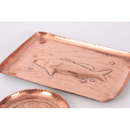 949 - A COLLECTION OF FOUR ARTS AND CRAFTS COPPER TRAYS a rectangular tray with embossed fish 22cm wide, a... 