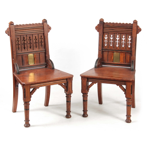 959 - A PAIR OF LATE 19TH CENTURY AESTHETIC PERIOD GOTHIC REVIVAL PITCH PINE HALL CHAIRS IN THE MANER OF A... 