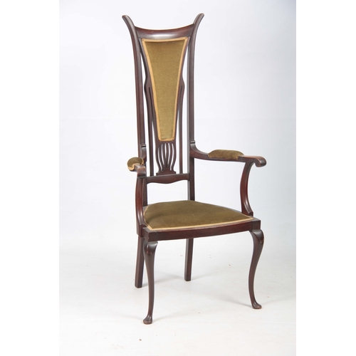 960 - AN ART NOUVEAU MAHOGANY LIBERTY STYLE OPEN ARMCHAIR with stylised shaped back and sweeping arms; sta... 