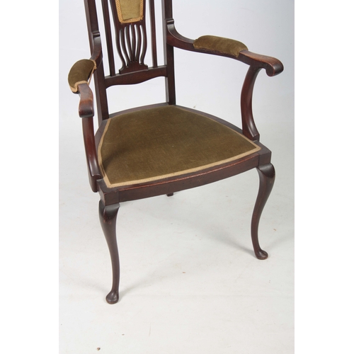 960 - AN ART NOUVEAU MAHOGANY LIBERTY STYLE OPEN ARMCHAIR with stylised shaped back and sweeping arms; sta... 