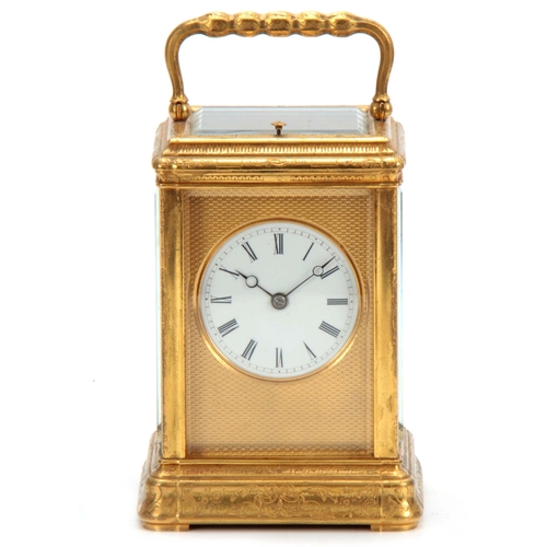 970 - A 19TH CENTURY FRENCH GILT BRASS ENGRAVED GORGE CASE CARRIAGE CLOCK REPEATER with folding handle and... 