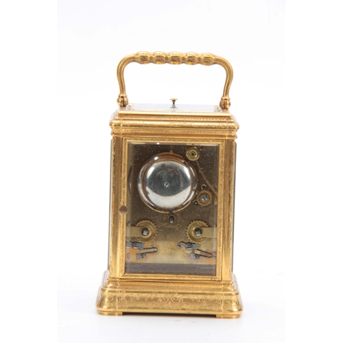 970 - A 19TH CENTURY FRENCH GILT BRASS ENGRAVED GORGE CASE CARRIAGE CLOCK REPEATER with folding handle and... 