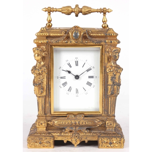 974 - A LATE 19th CENTURY FRENCH GILT CASED CARRIAGE CLOCK with figural columns enclosing a 2.25